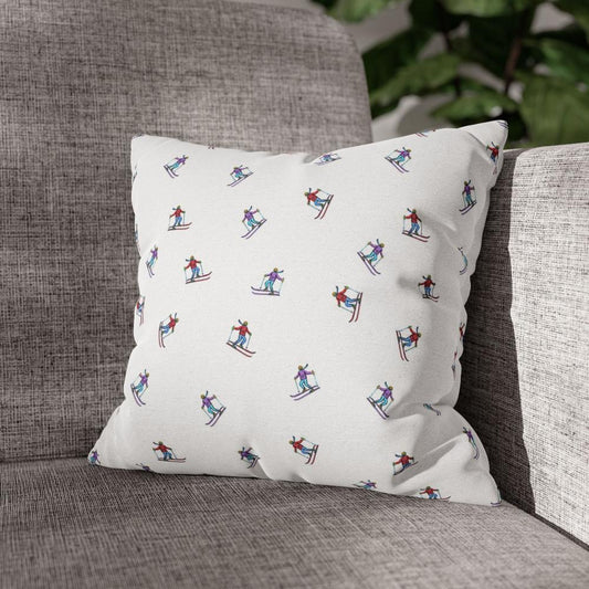 Lifestyle view of a pillow case with an illustrated skier pattern, titled 'Carving the Slopes,' placed on a couch, adding a winter sports-inspired touch to the living room decor.